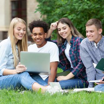 ground of young people sitting on lawn